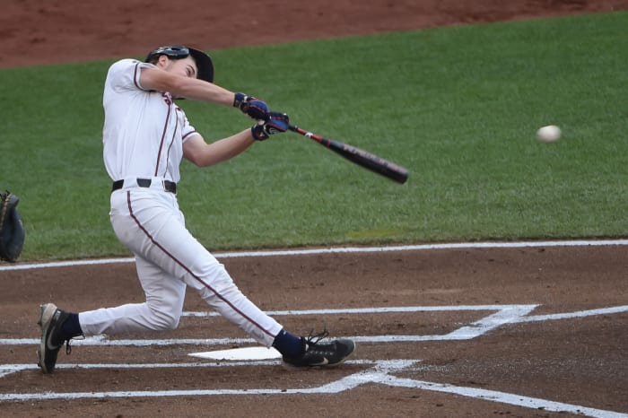 Jun 22, 2021; Omaha, Nebraska, USA; Virginia Cavaliers catcher Kyle Teel (3) singles in a run in the first inning against the Mississippi State Bulldogs at TD Ameritrade Park. Mandatory Credit: Steven Branscombe-USA TODAY Sports